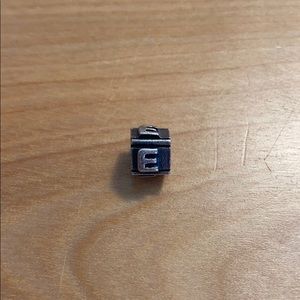 Sterling silver “E” charm